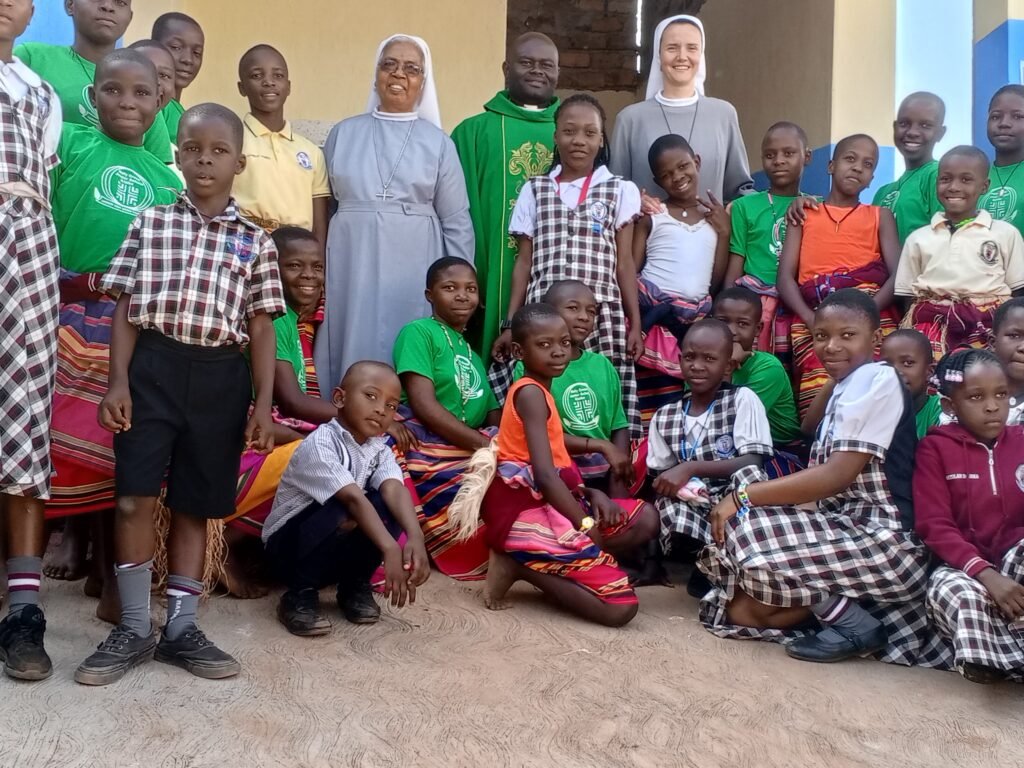 Pupils and dancers during the blessing of boy hostel with the main celebrant